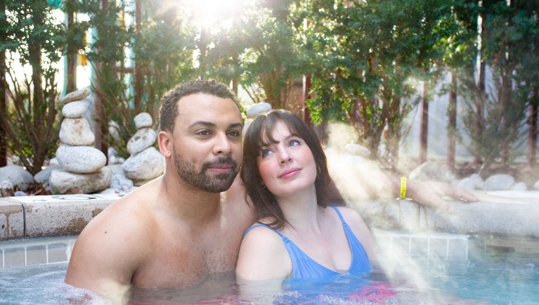 A couple enjoy a moment in the Outdoor Whirlpool Hot Springs