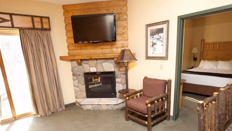 The fireplace and TV in the Black Bear Condo