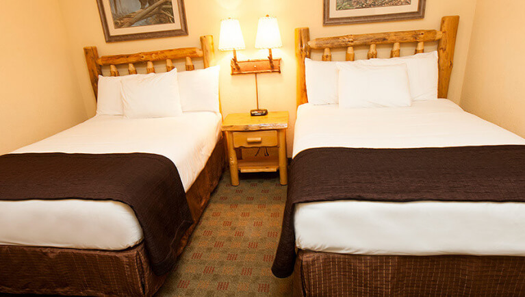The full beds in the Black Bear Condo