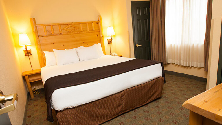 The California king bed in the Timber Wolf Condo