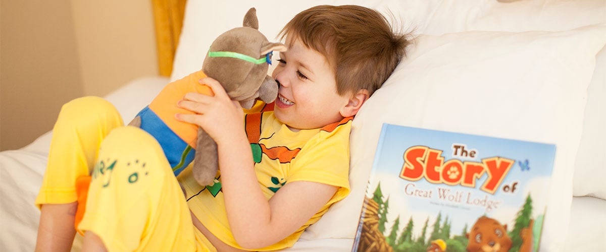 A child enjoys more time in bed at Great Wolf Lodge