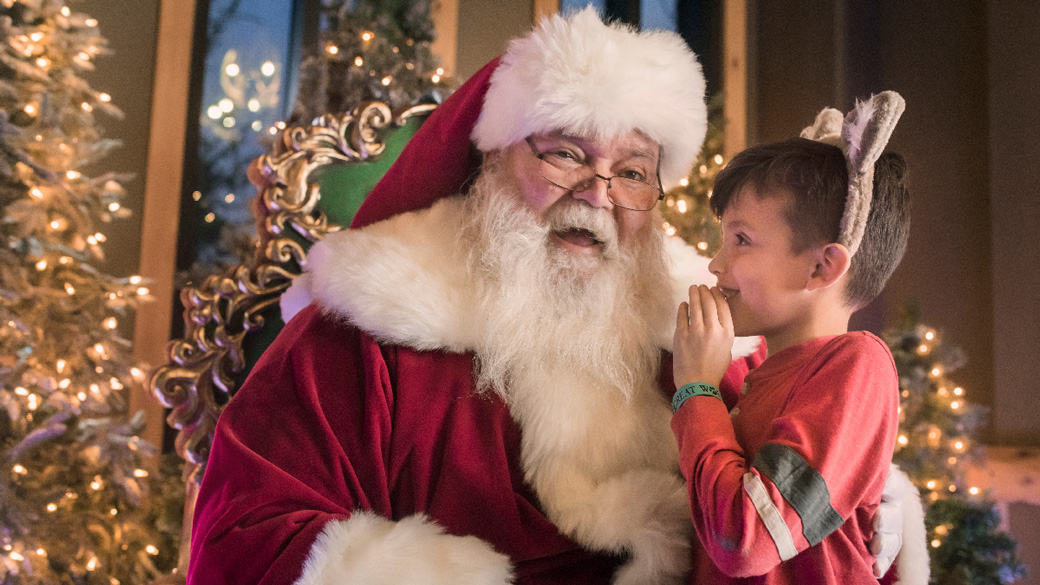 Kid sitting on Santa's lap