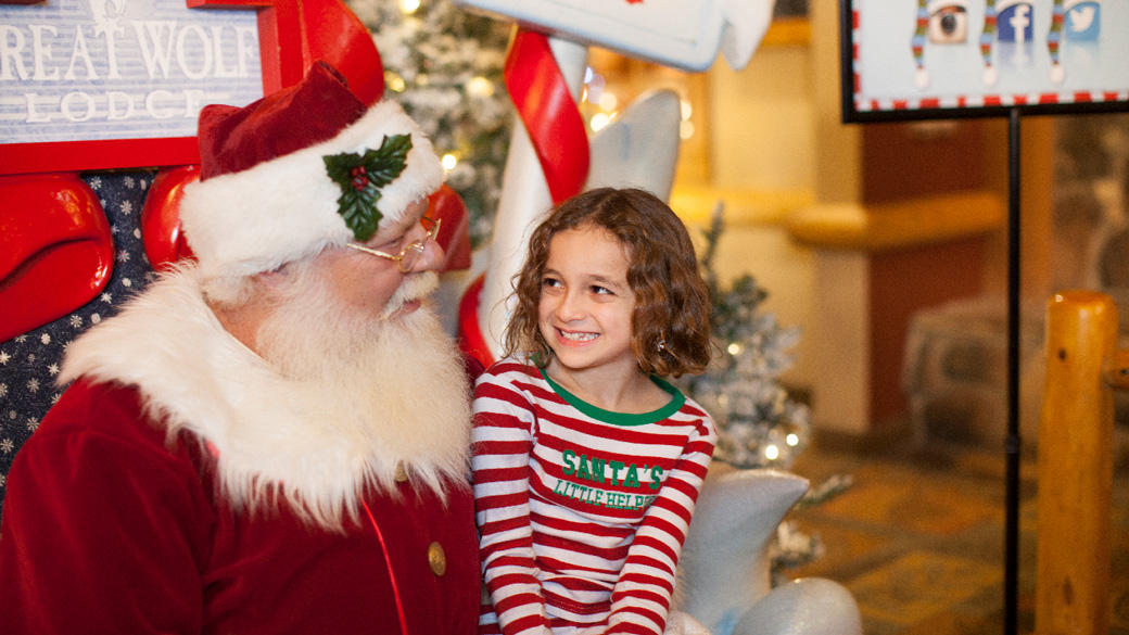 Girl sitting on Santa's lap