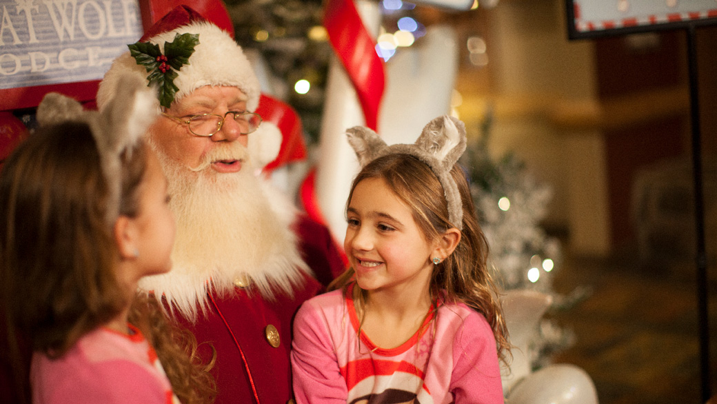 Girl sitting on Santa's lap