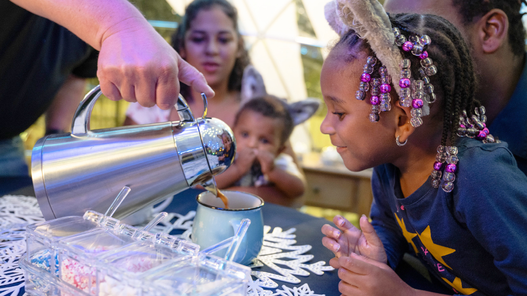 Serving hot chocolate to a kid