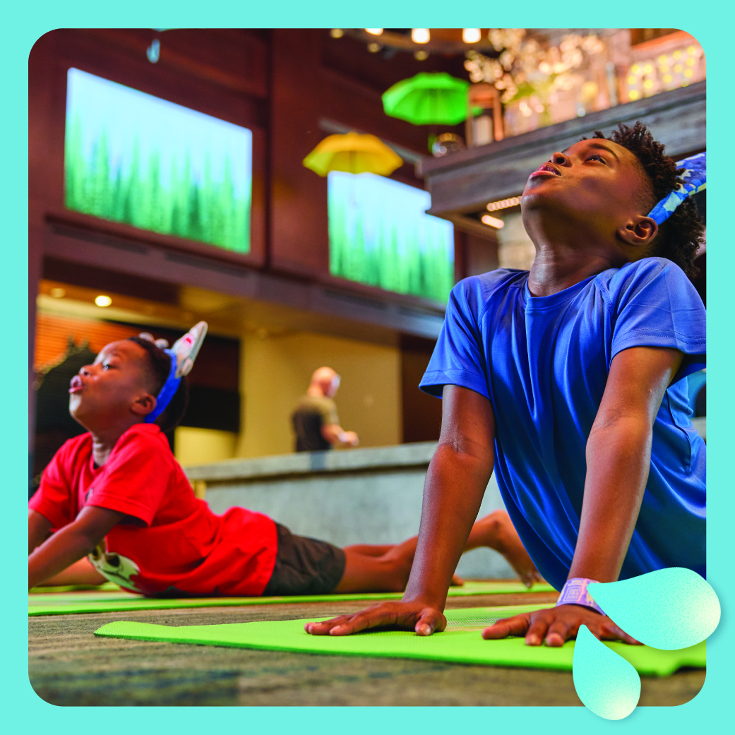 Two kids stretching during yoga activity