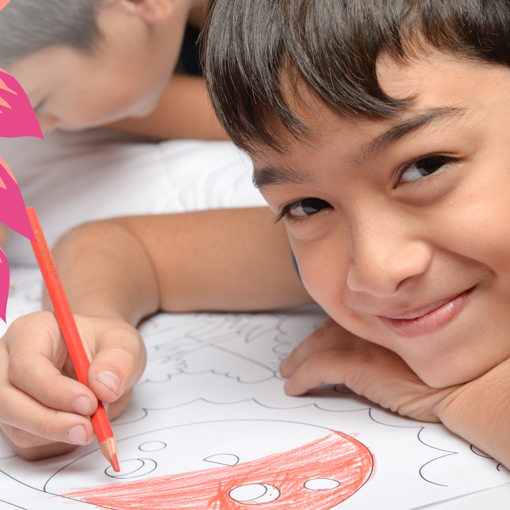 boy coloring a spring coloring book
