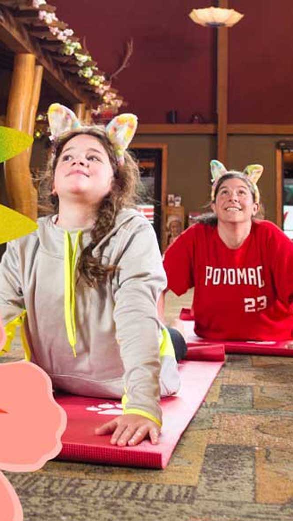 Three kids streching during yoga activity