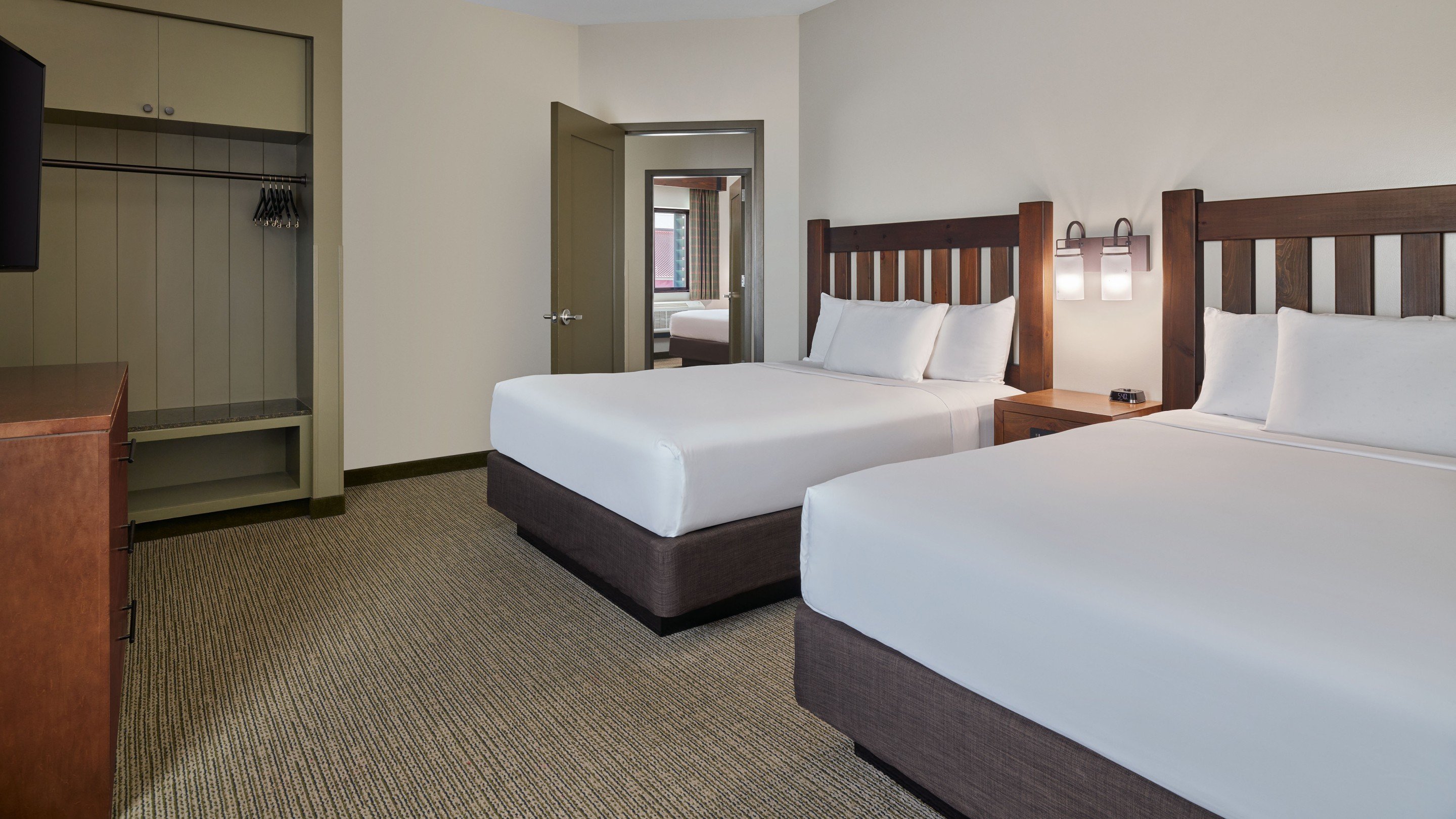 The queen beds in the Grizzly Bear Suite