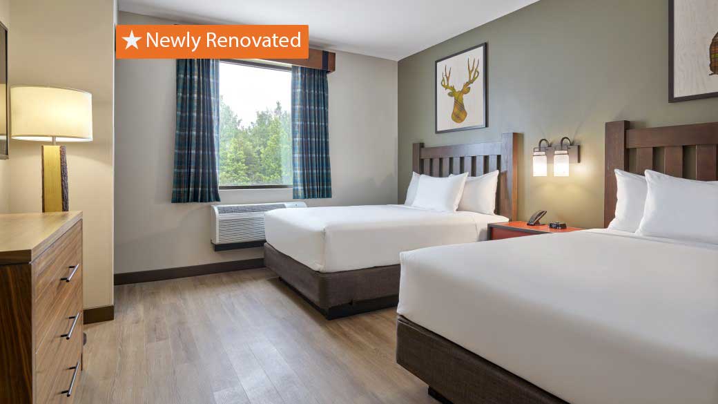 Double queen beds in the Accessible Bathtub Double Queen Suite