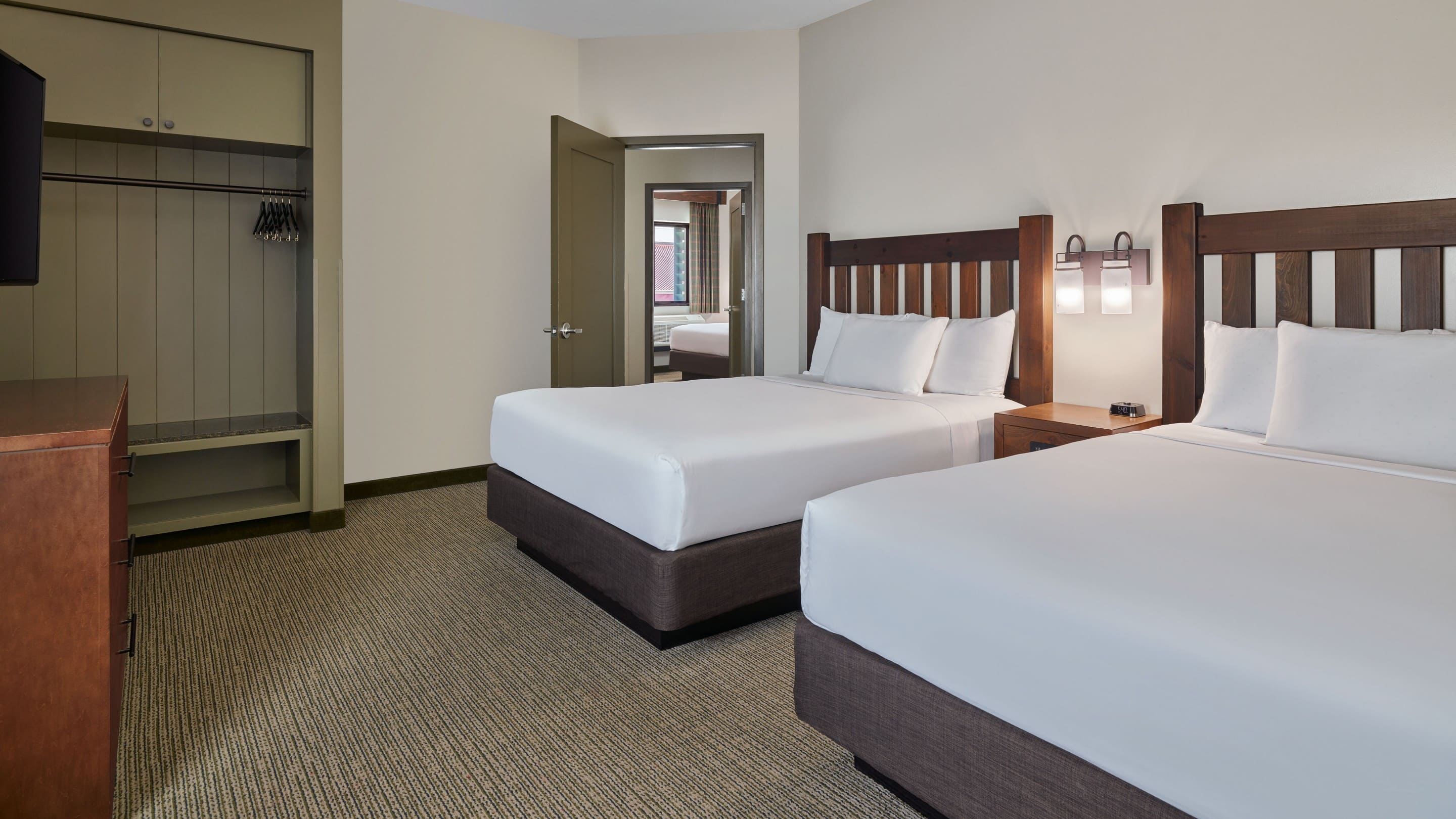 The queen beds in the accessible Grizzly Bear Suite