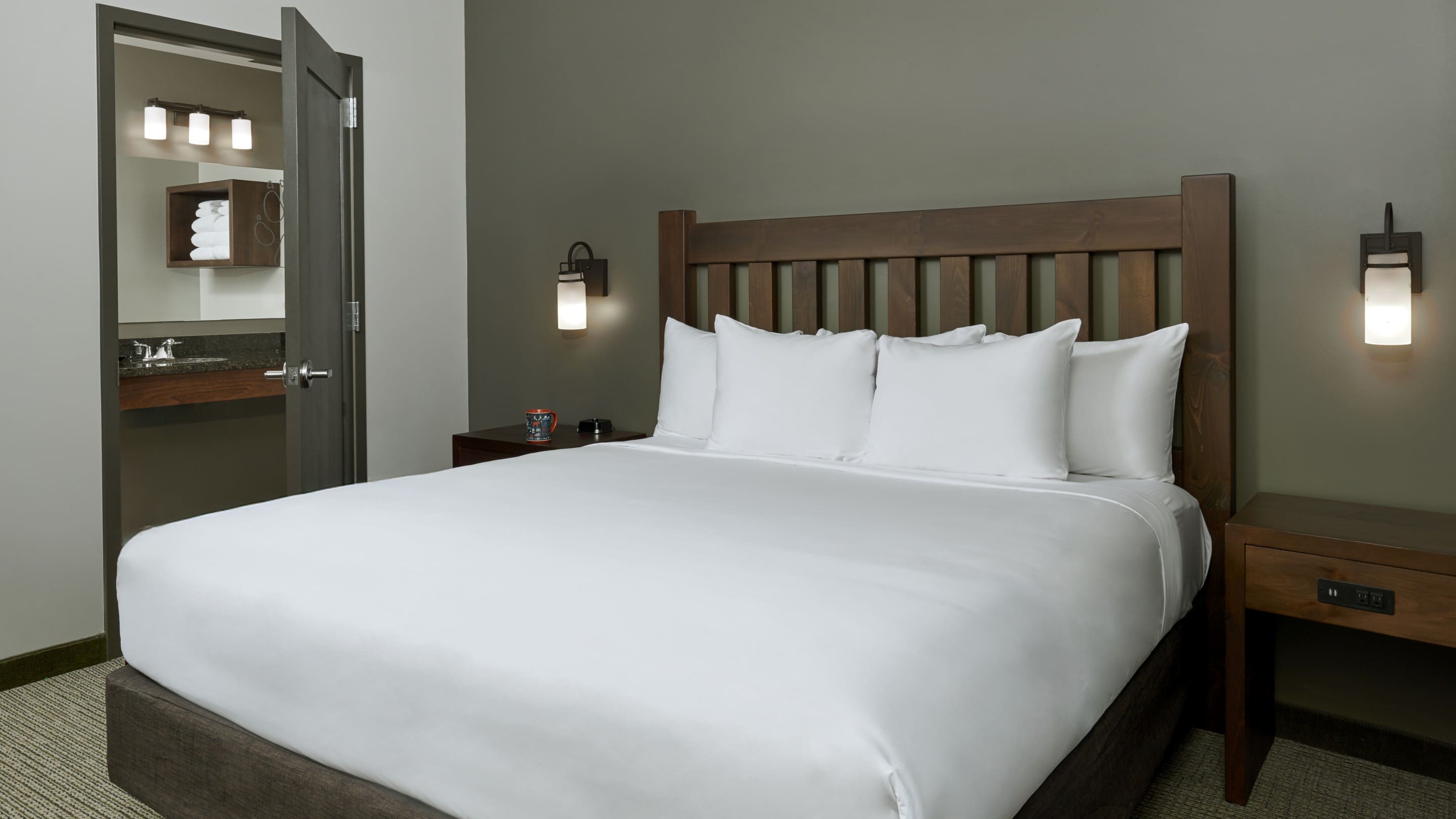 The king bed in the accessible Grizzly Bear Suite