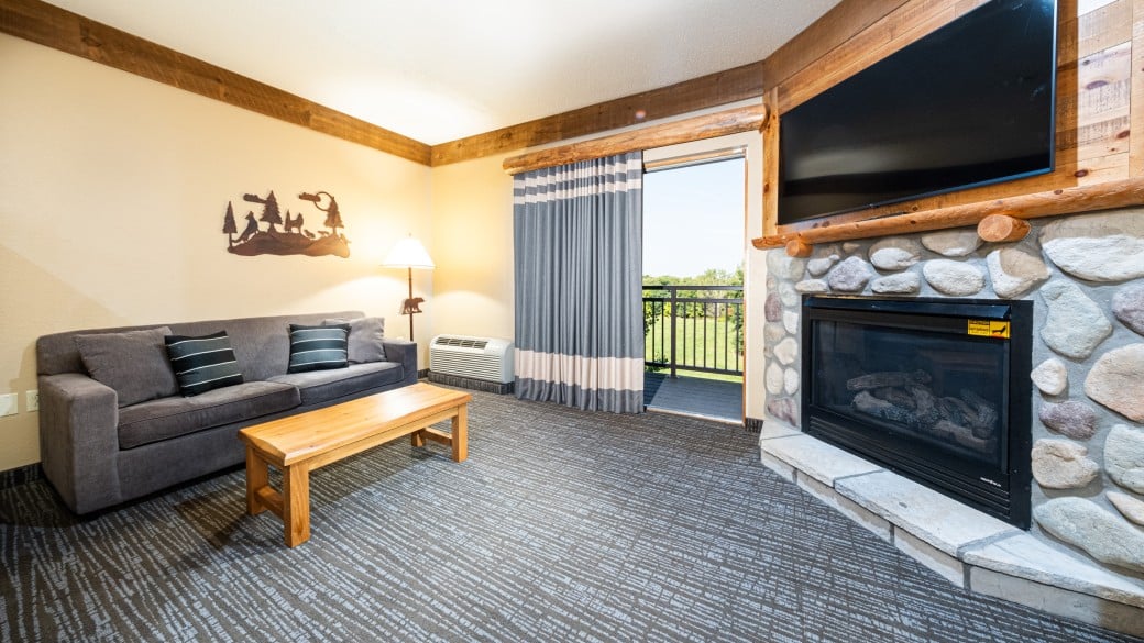 The beds and sofa in the Family Fireplace Suite