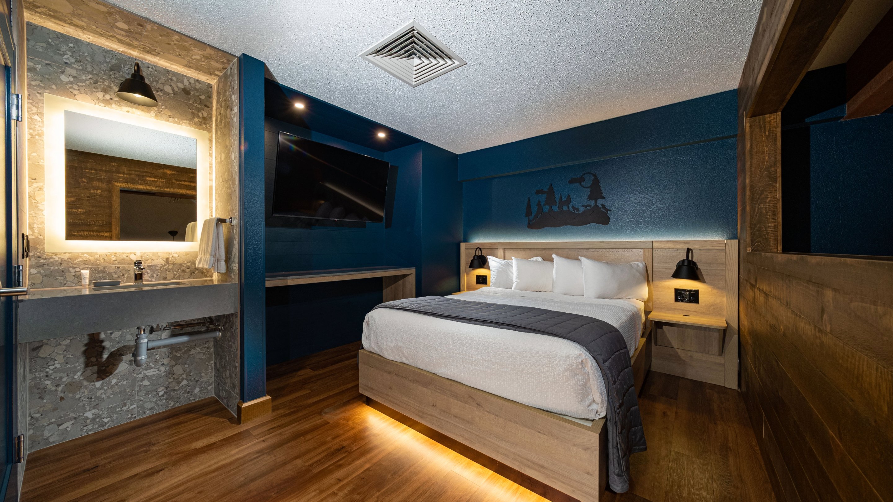 The queen bed and sink area in the Loft area.