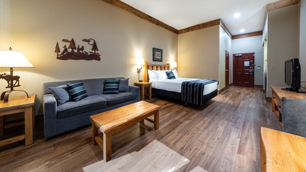 Queen bed in the Accessible Queen Sofa Suite at Great Wolf Lodge Niagara Falls, ON.