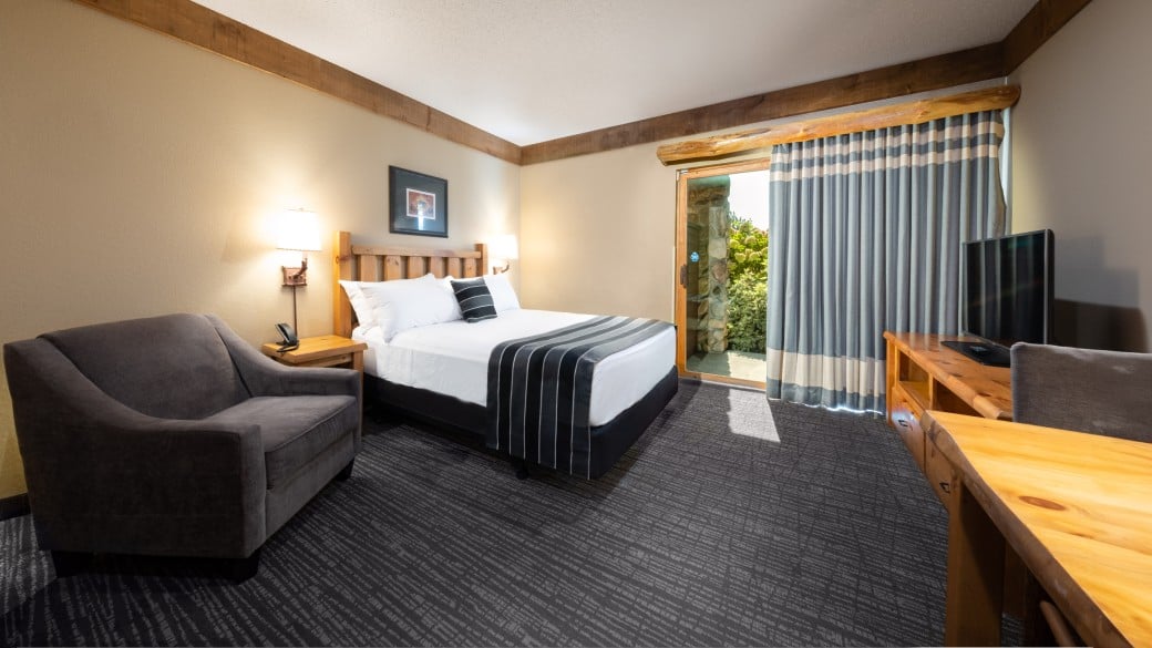 The bed and indoor cabin with bunk beds in the accessible Wolf Den Suite at Great Wolf Lodge NIagara Falls, ON.