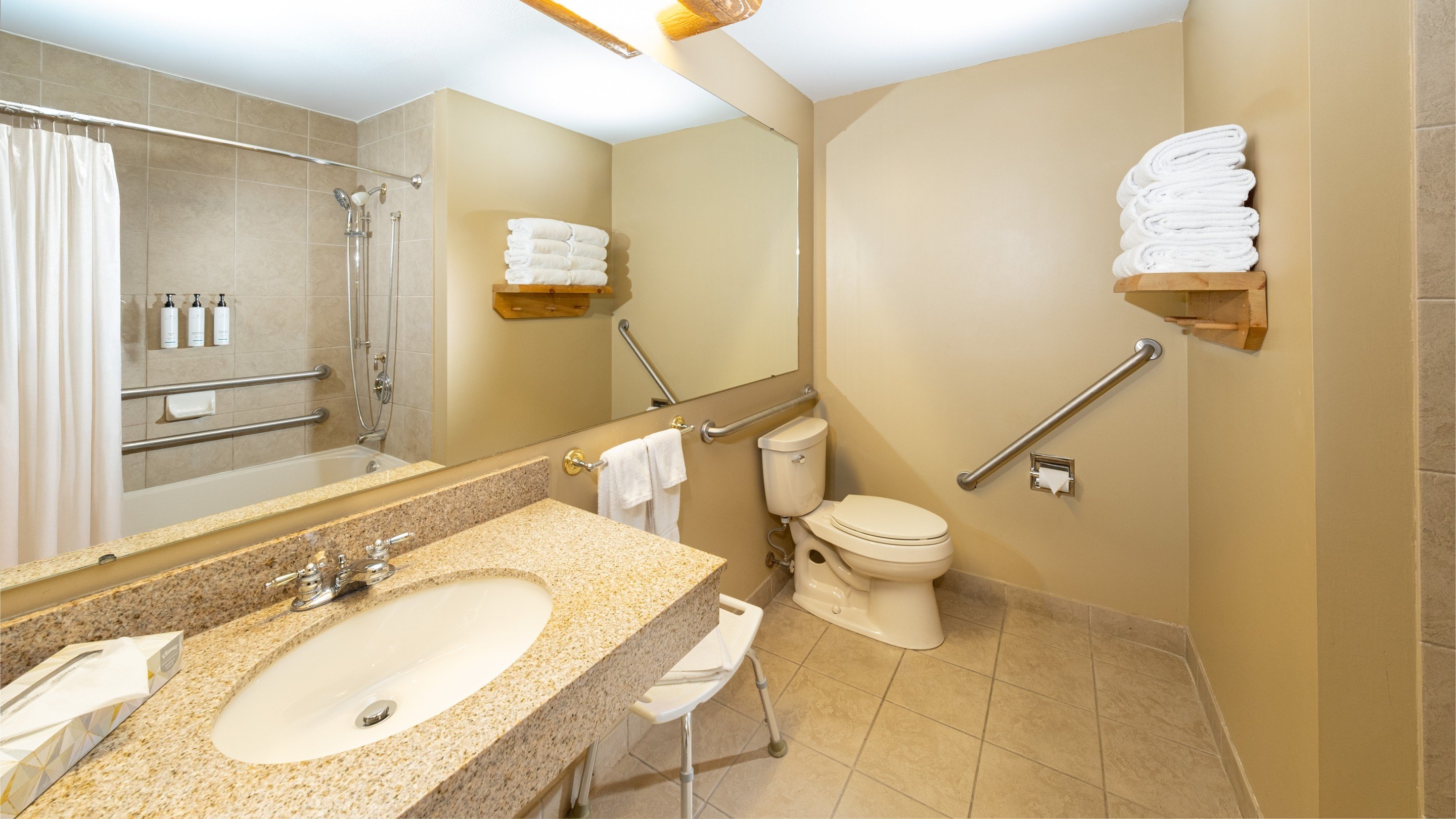 The Bathroom and sink area in the accessible Wolf Den Suite at Great Wolf Lodge NIagara Falls, ON.