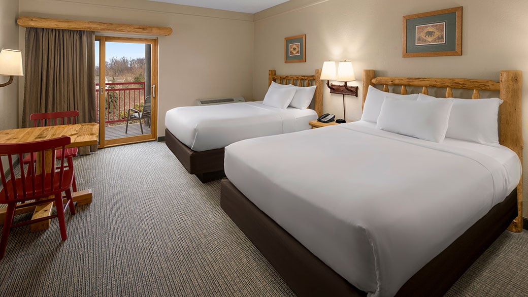 Two double queen beds in a suite