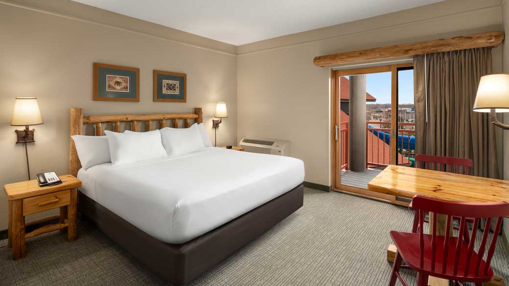 queen bed and patio door