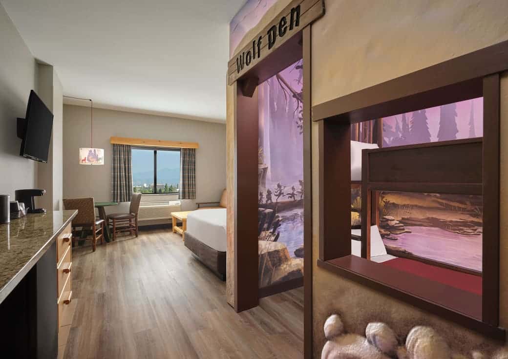 The room view with bunk beds and queen bed in Wolf Den Suite