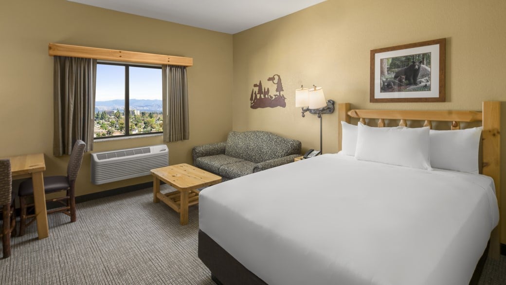 The Queen Bed in the Wolf Den Suite (Accessible Shower)