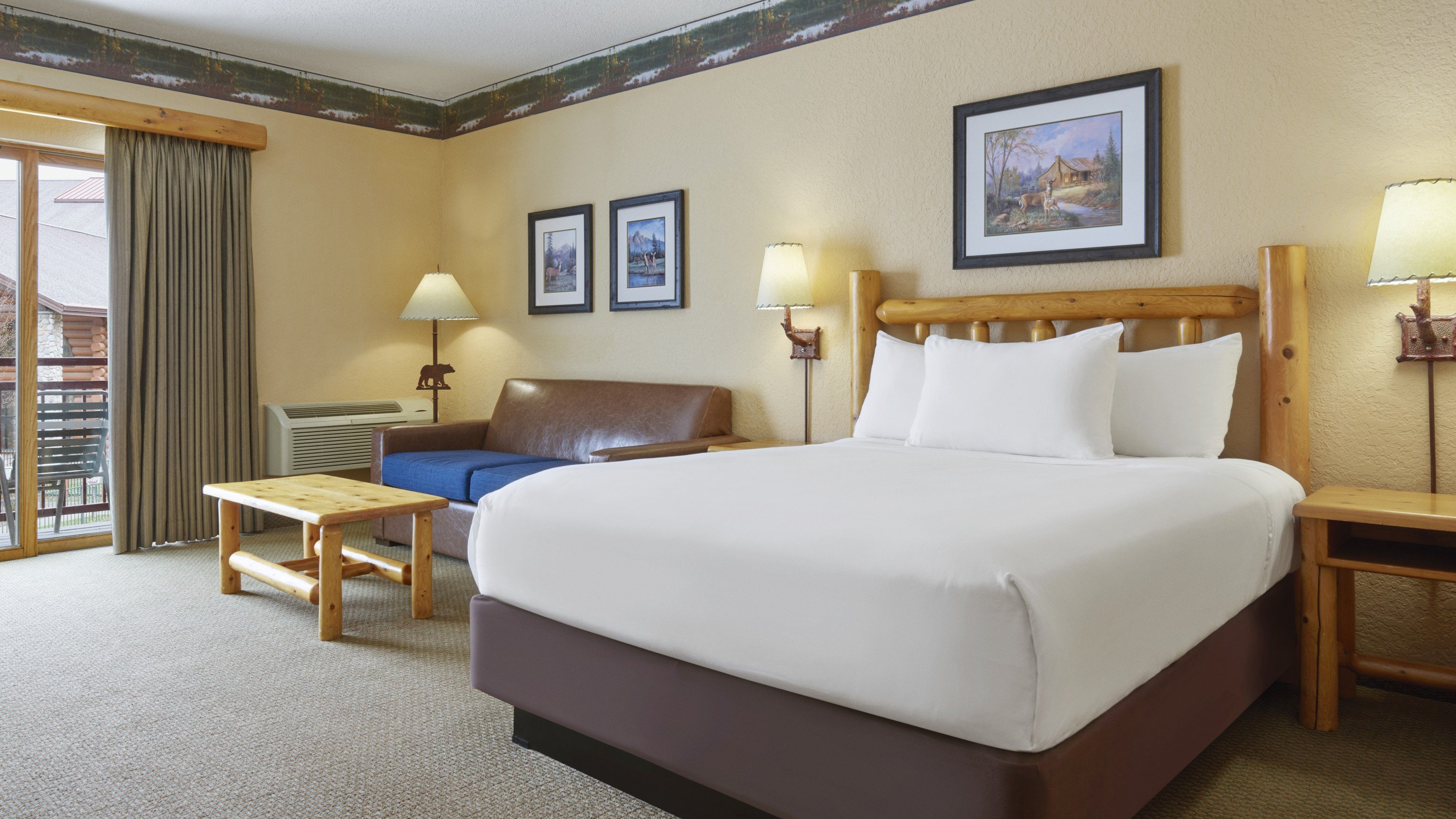 The bunk beds and TV inside the tent in the KidKamp Suite