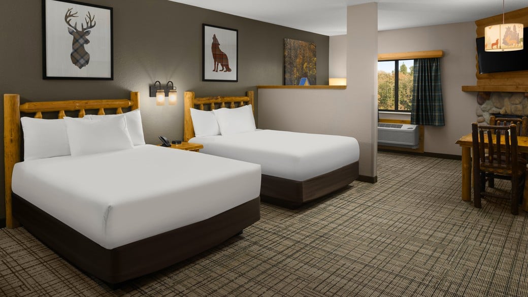 The beds in the Lone Wolf Fireplace Suite