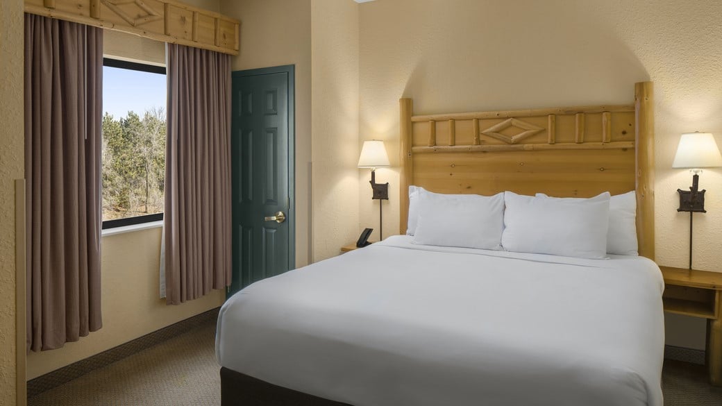 The king bed in the Wolf Pack Loft Condo