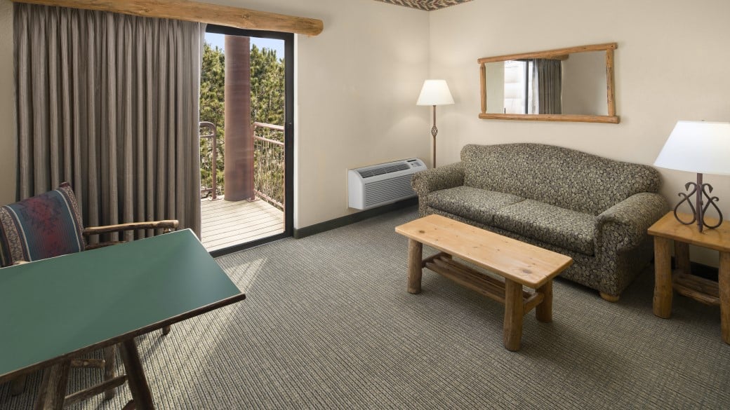 Queen beds and sofa in the Double Queen Sofa Suite (Balcony/Patio)