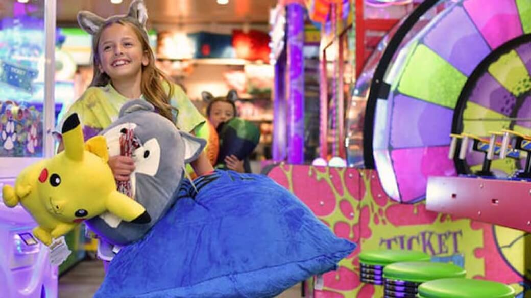 Girl winning big plush toys