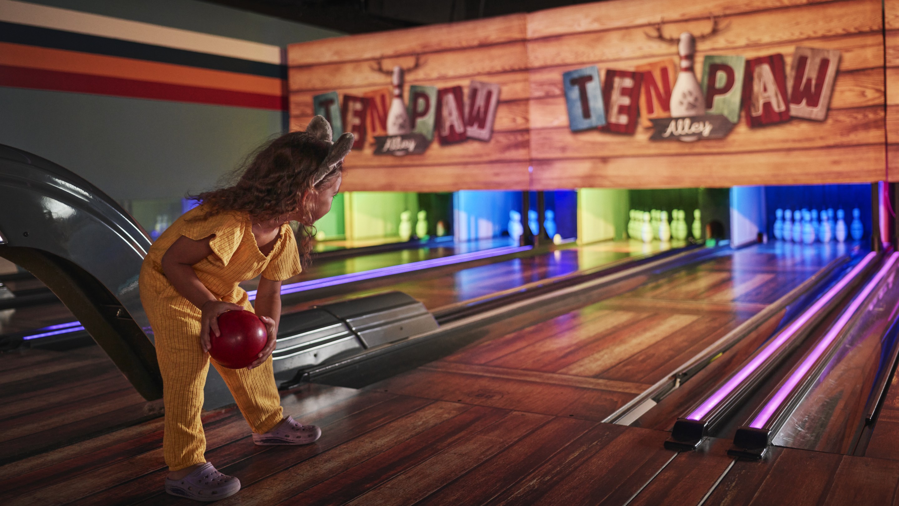 Little girl bowling