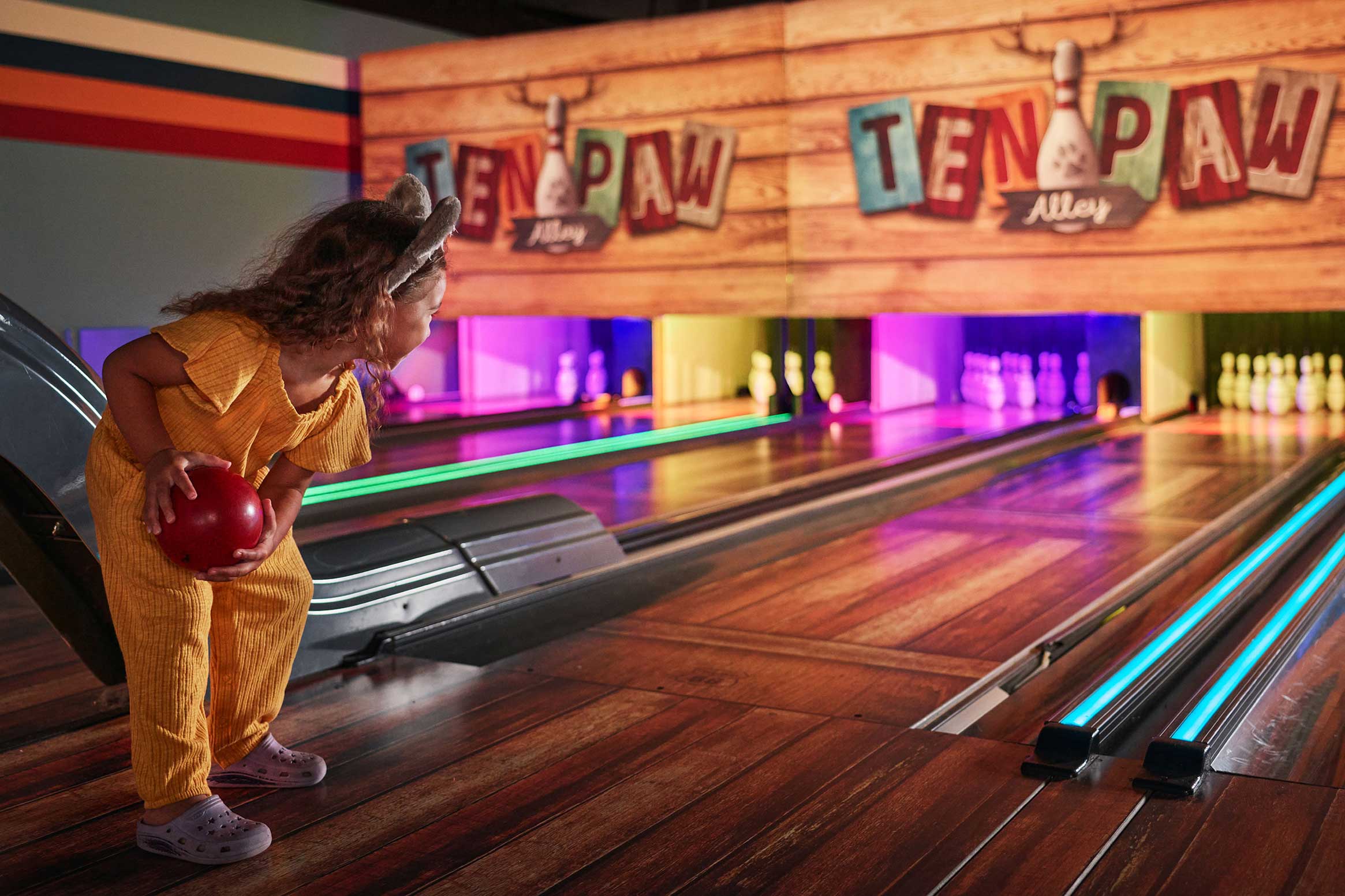 girl playing bowling