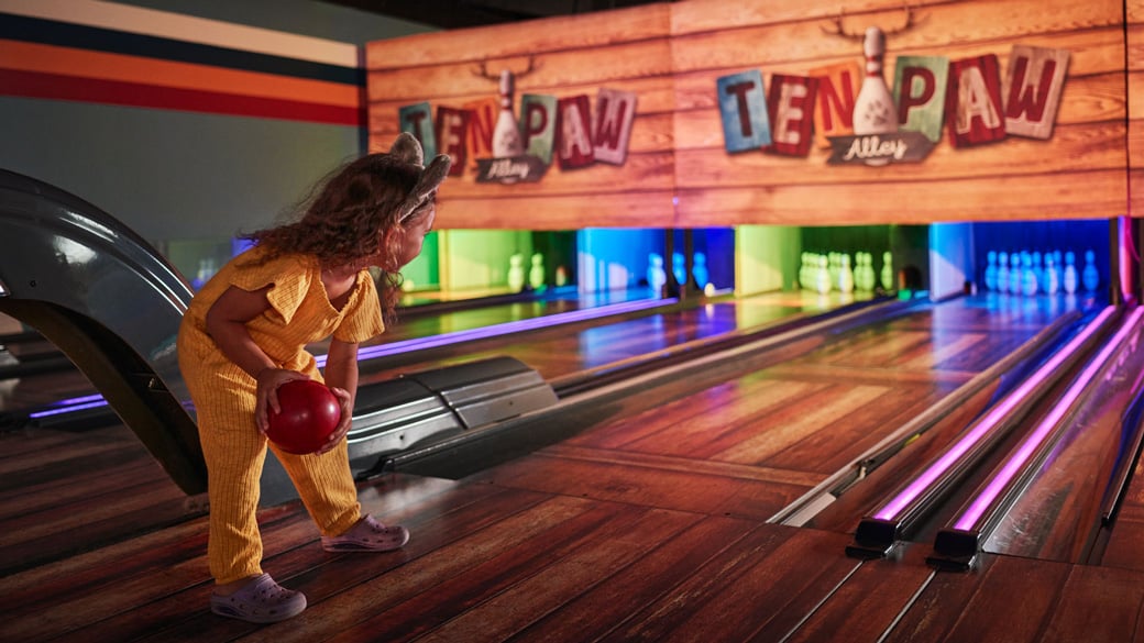 little girl bowling at Tenpaw Alley