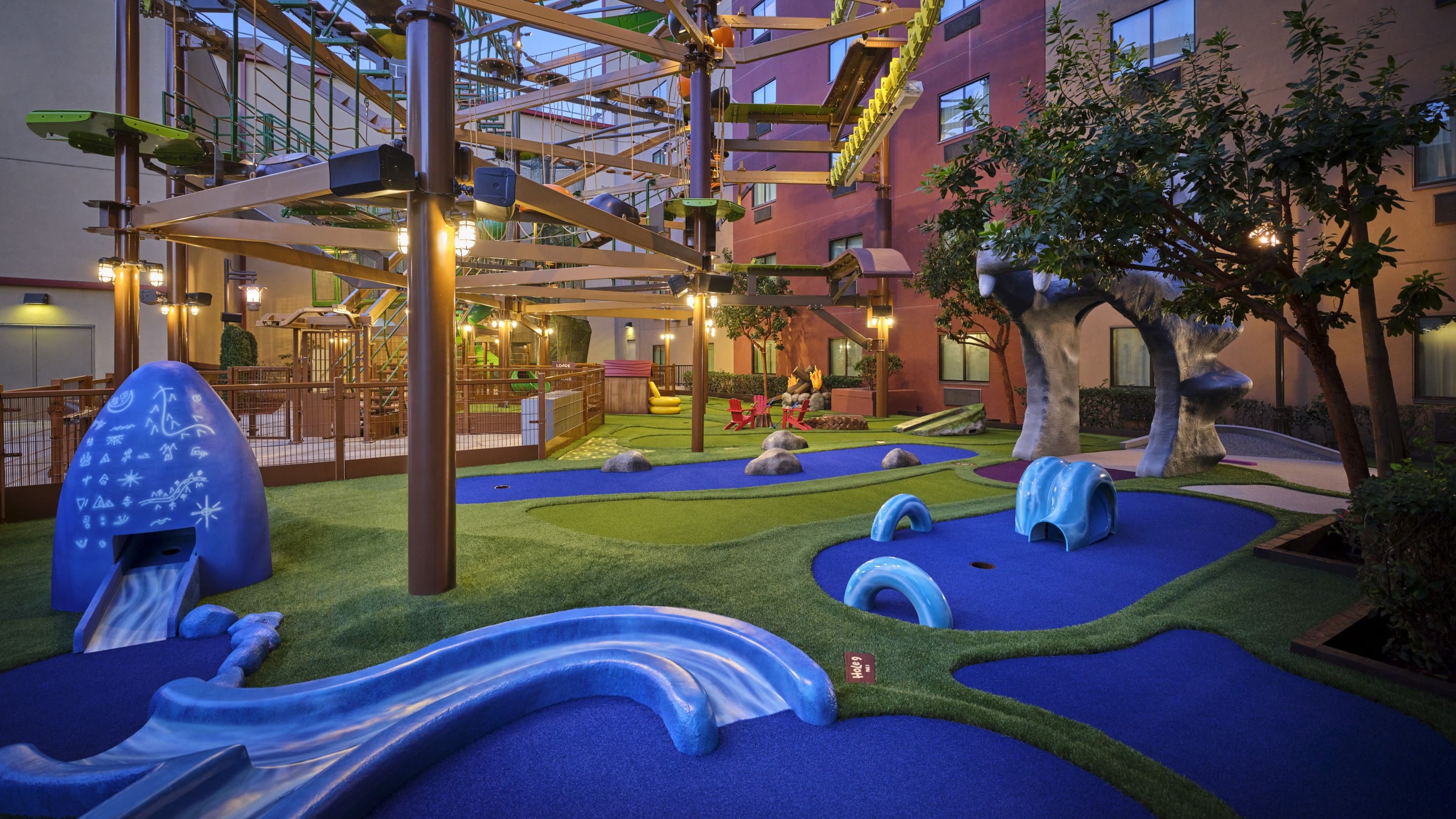 Indoor mini golf course with colorful obstacles and structures