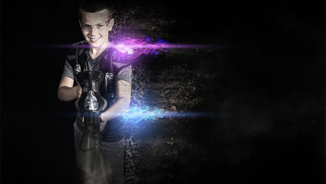 A boy holding a laser gun