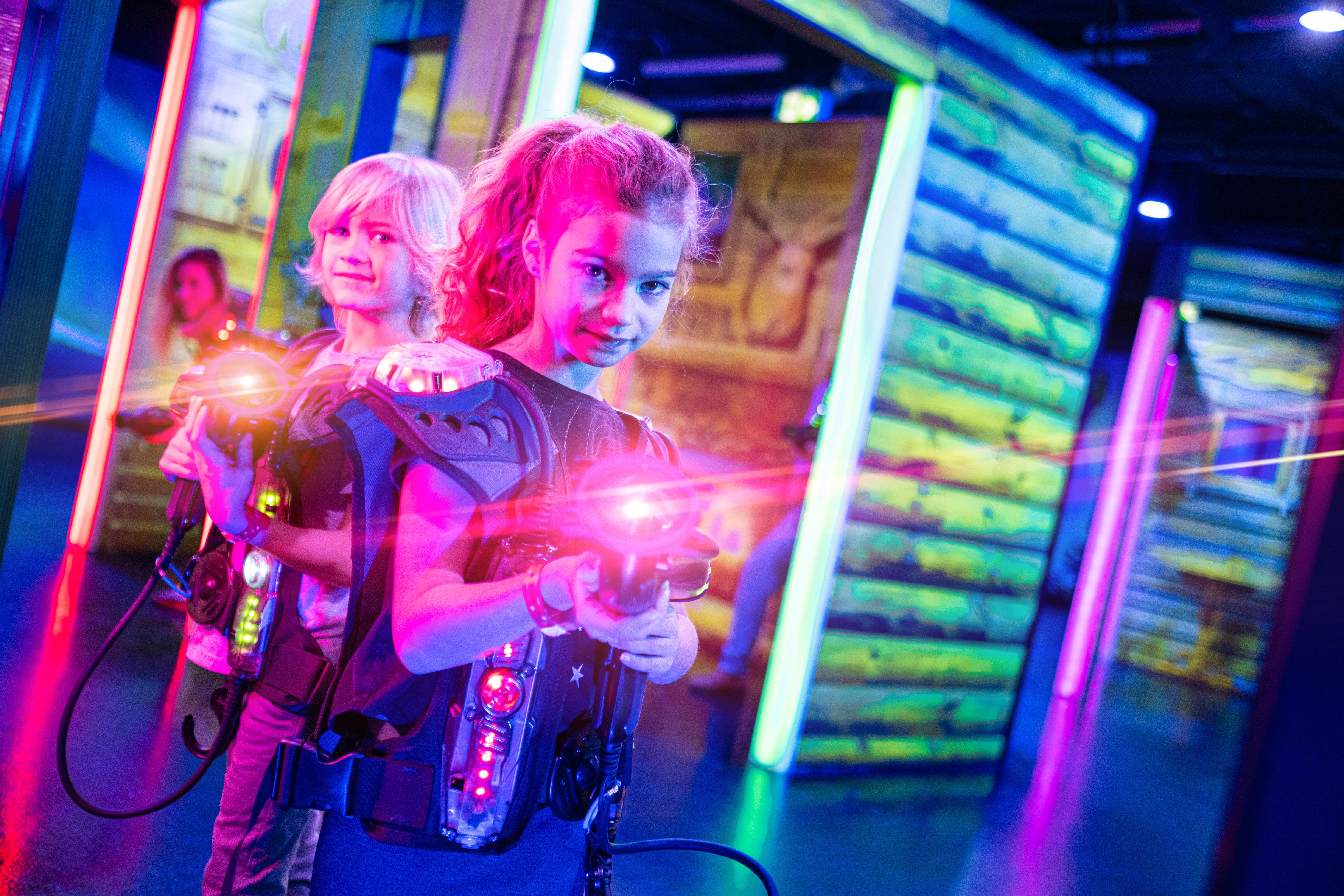 Siblings playing Laser tag