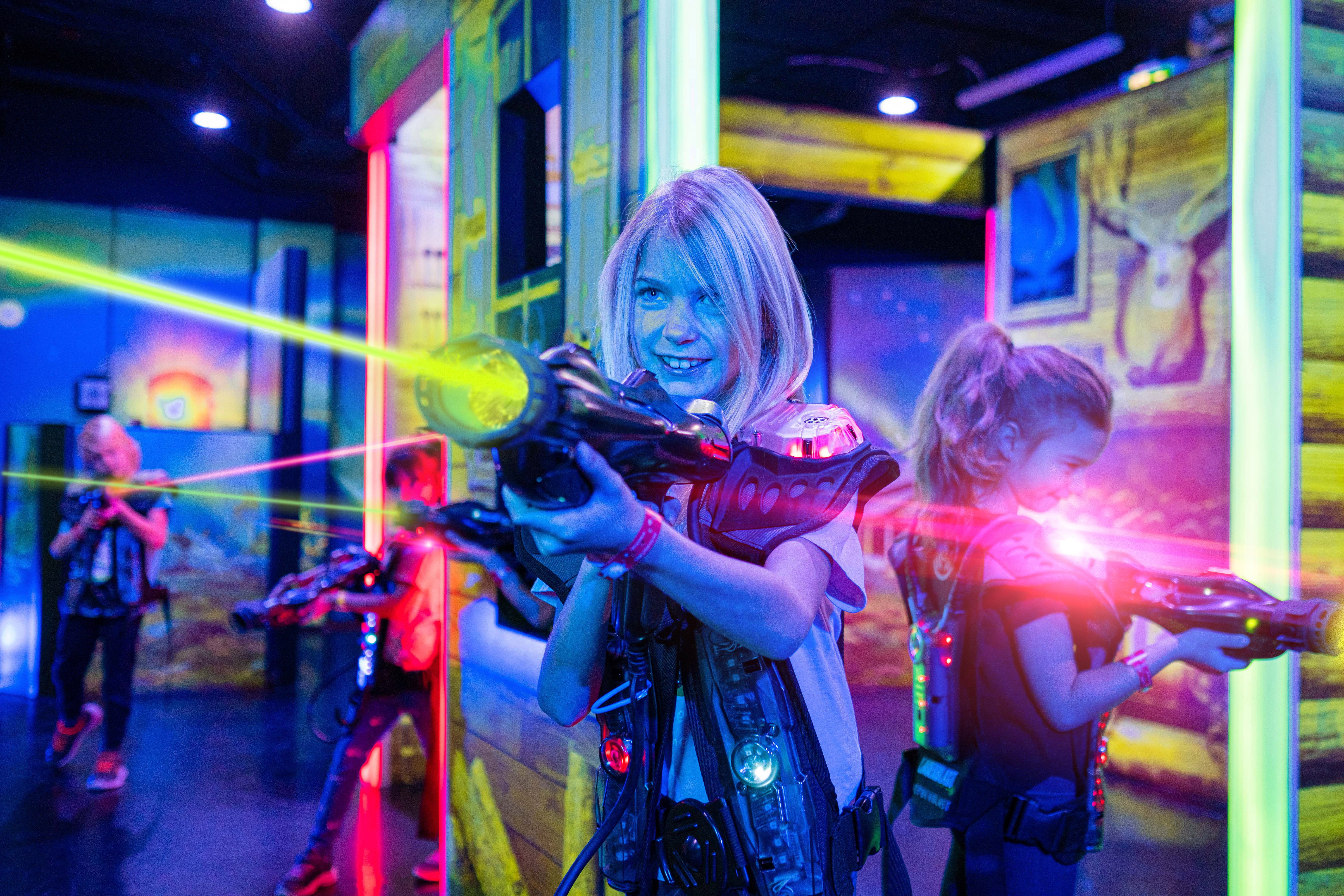 A boy holding a laser gun