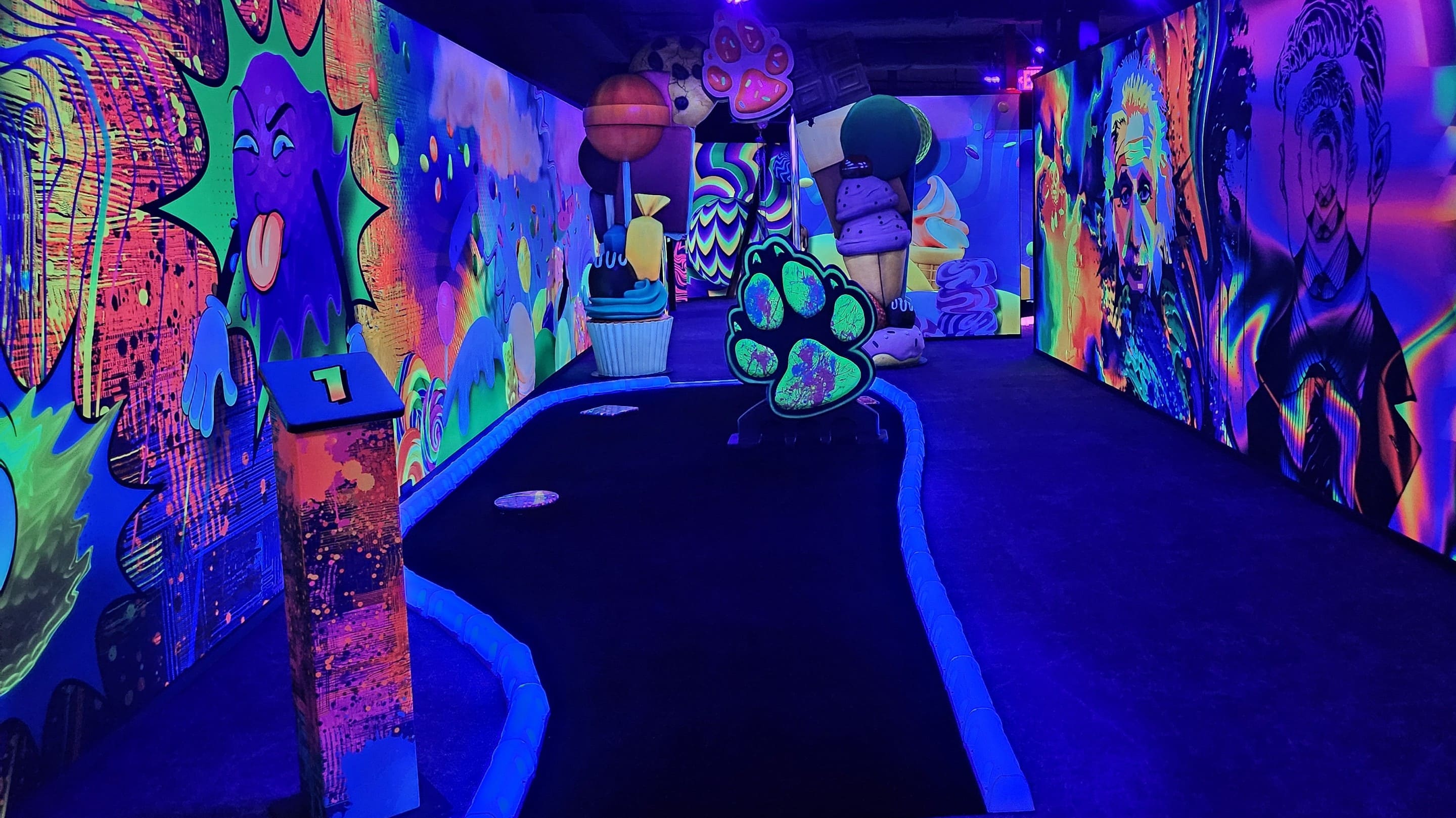 Glow-in-the-dark mini golf course artwork