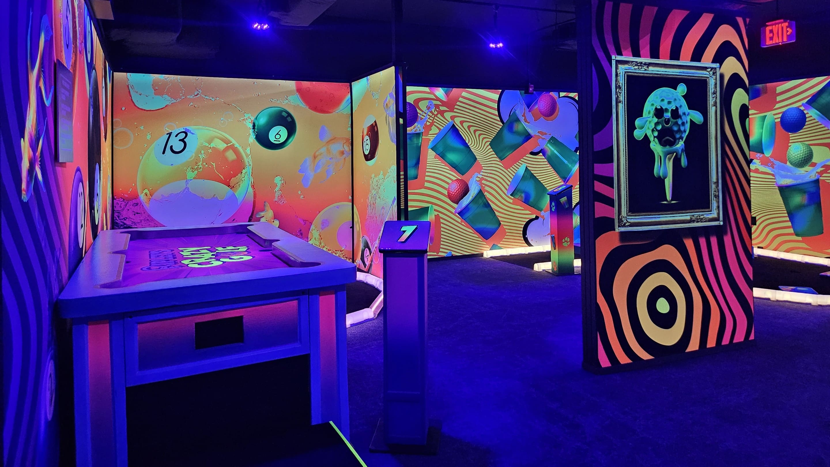 Neon, psychedelic walls in mini golf course