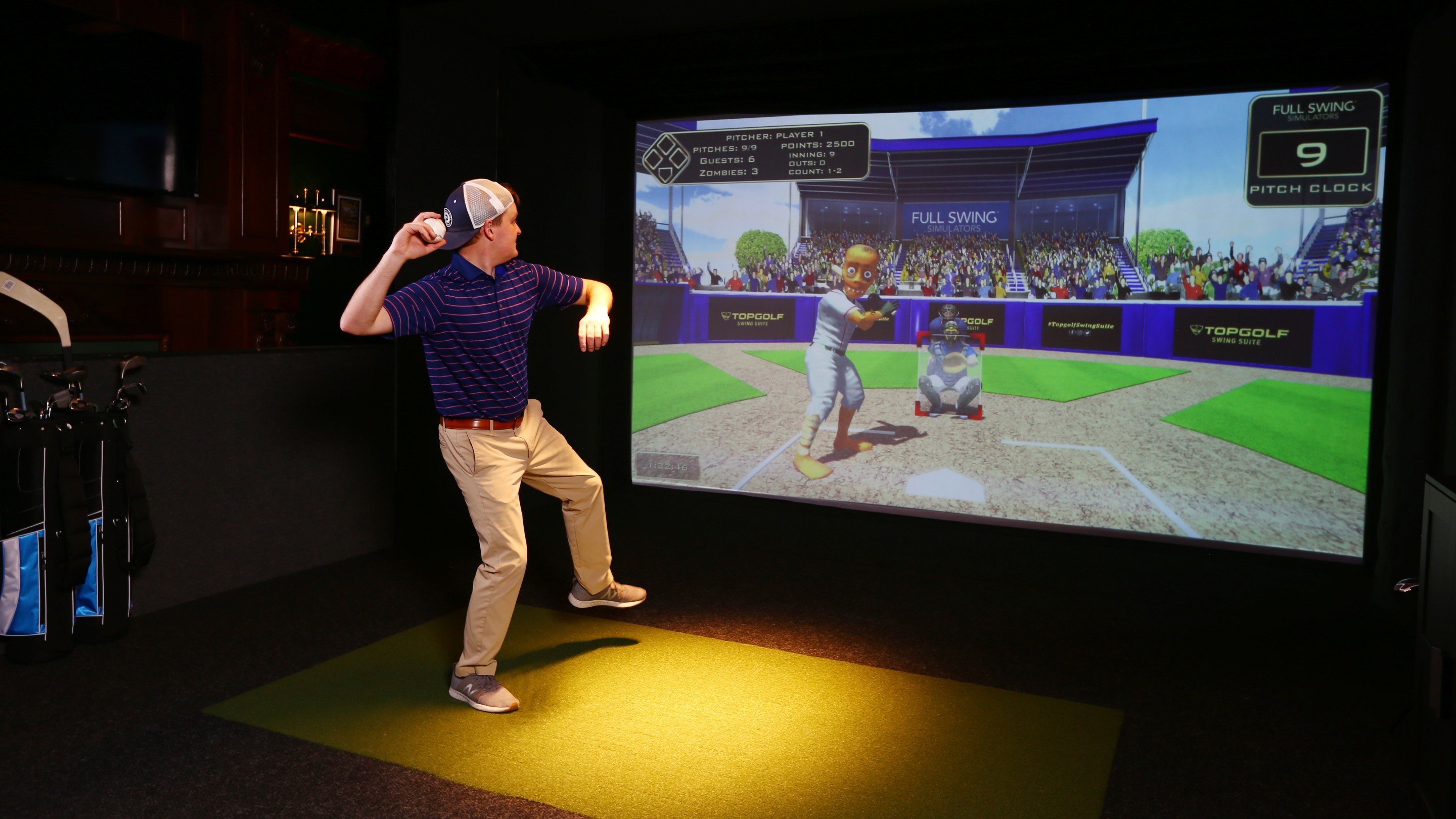Man pitching in virtual baseball game