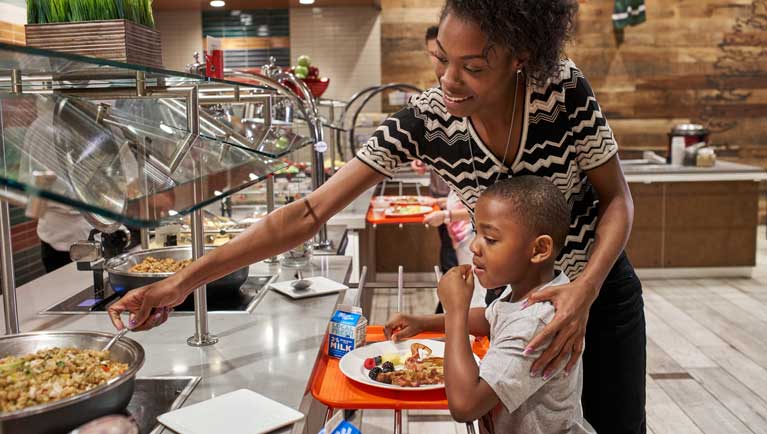 mother and son at the buffet