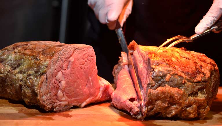 chef serving leg lamb