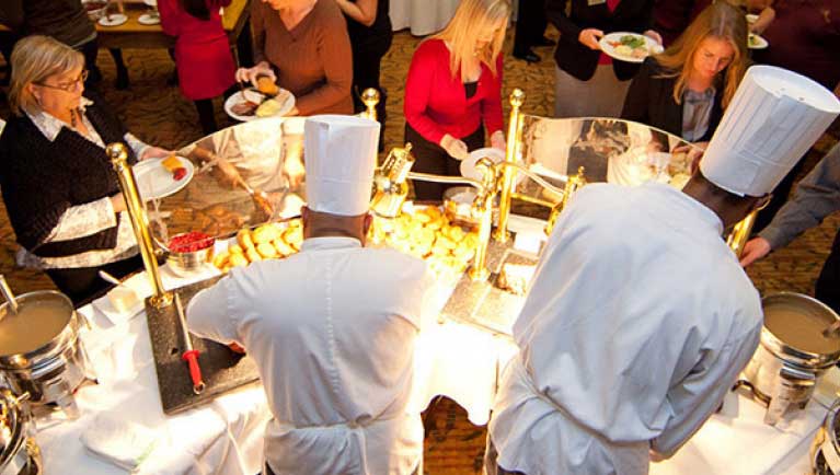 two chefs serving food