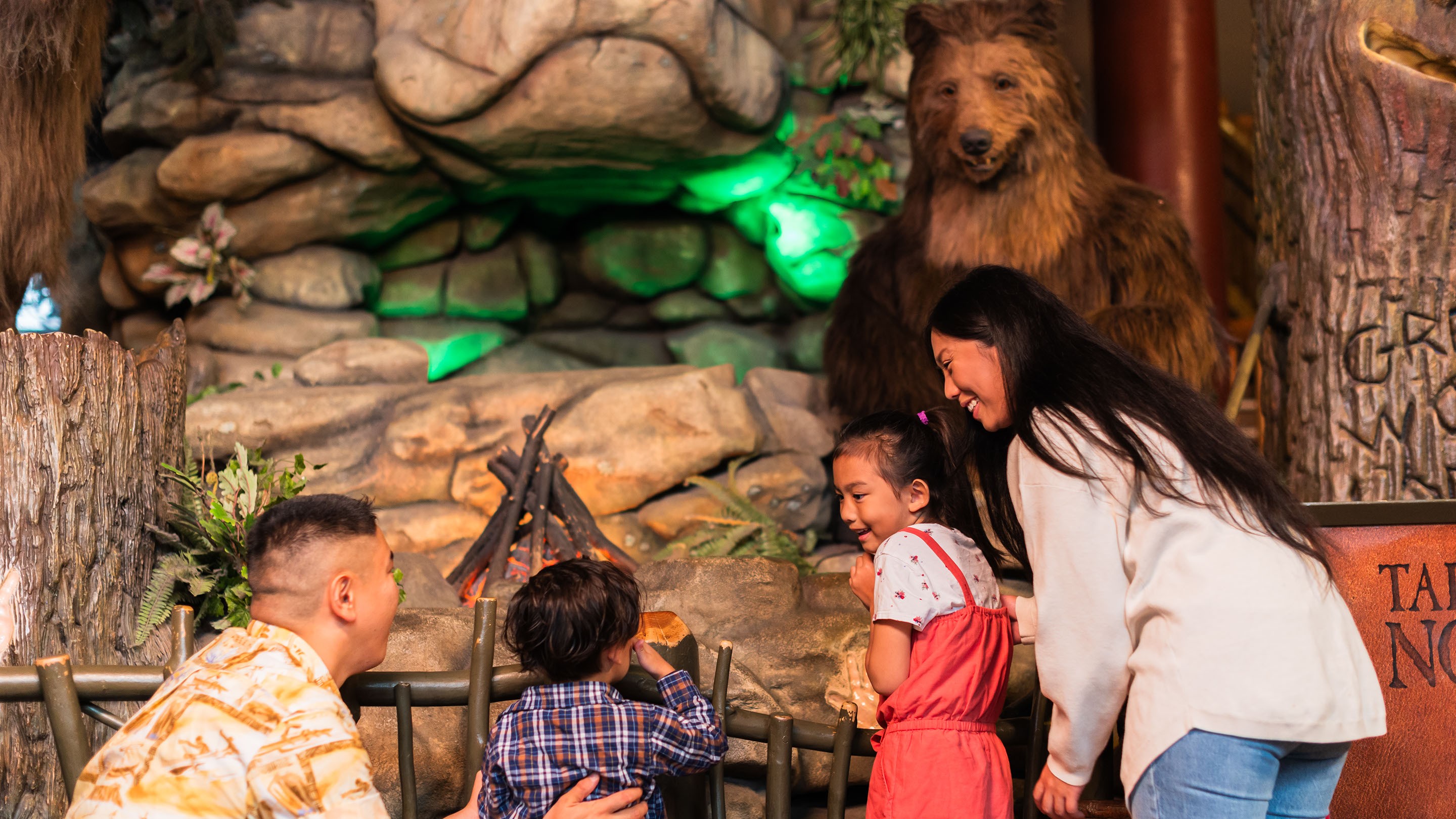 Family watching the Bear statue