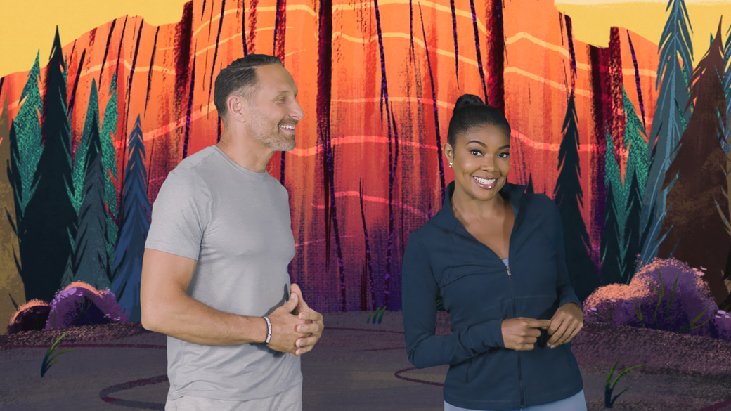 female trainer smiles as male trainer looks at her