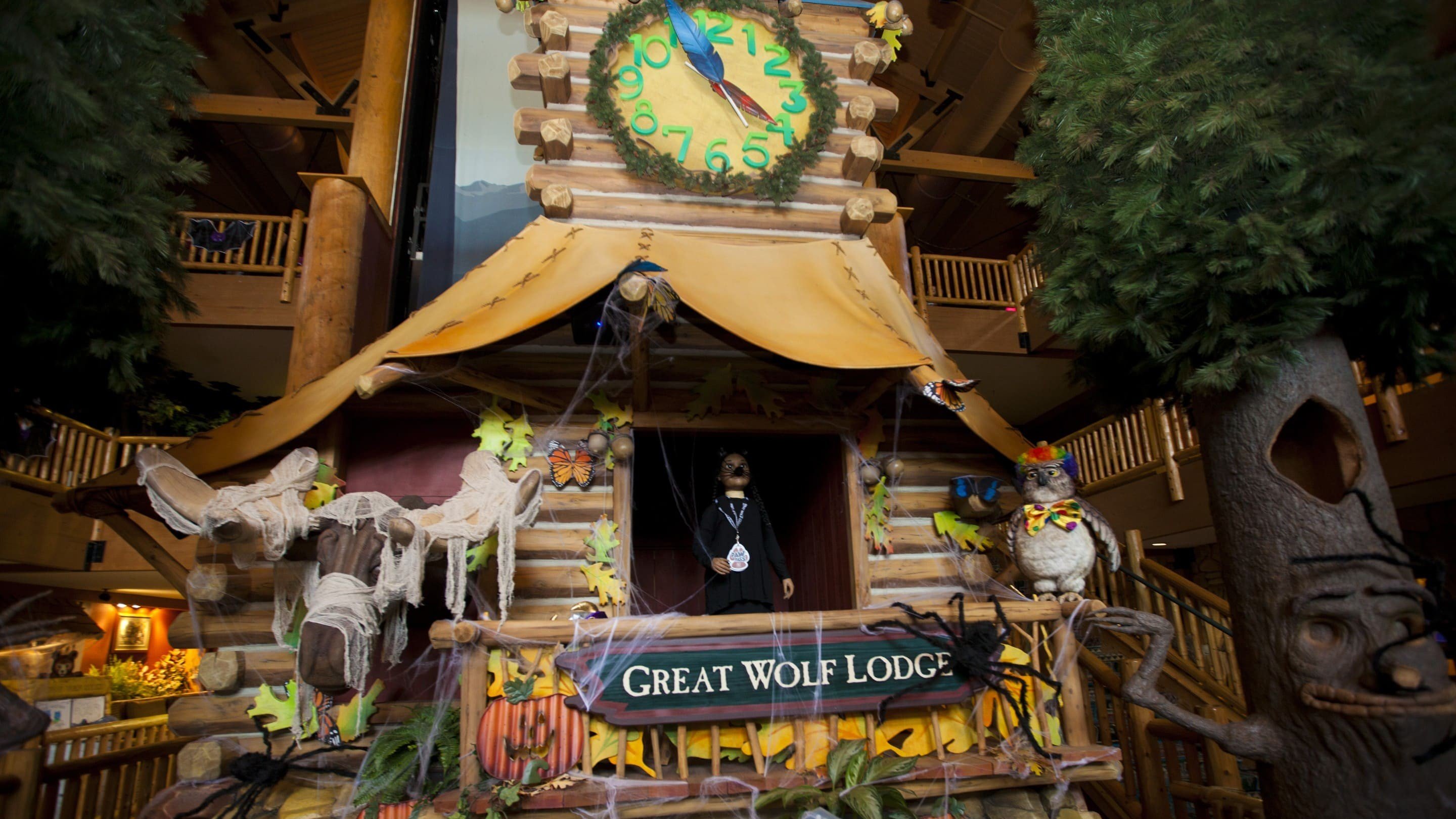 Children and families watching indoor show at lodge