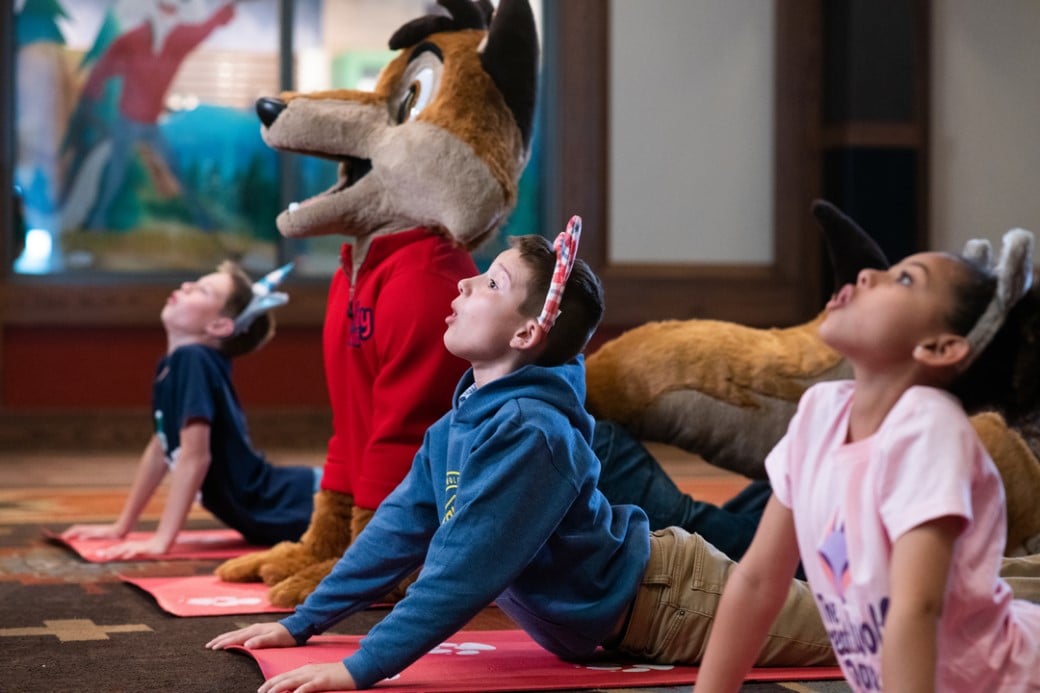 kids doing yoga with Wiley the wolf