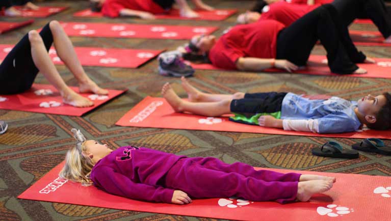 Children learning yoga