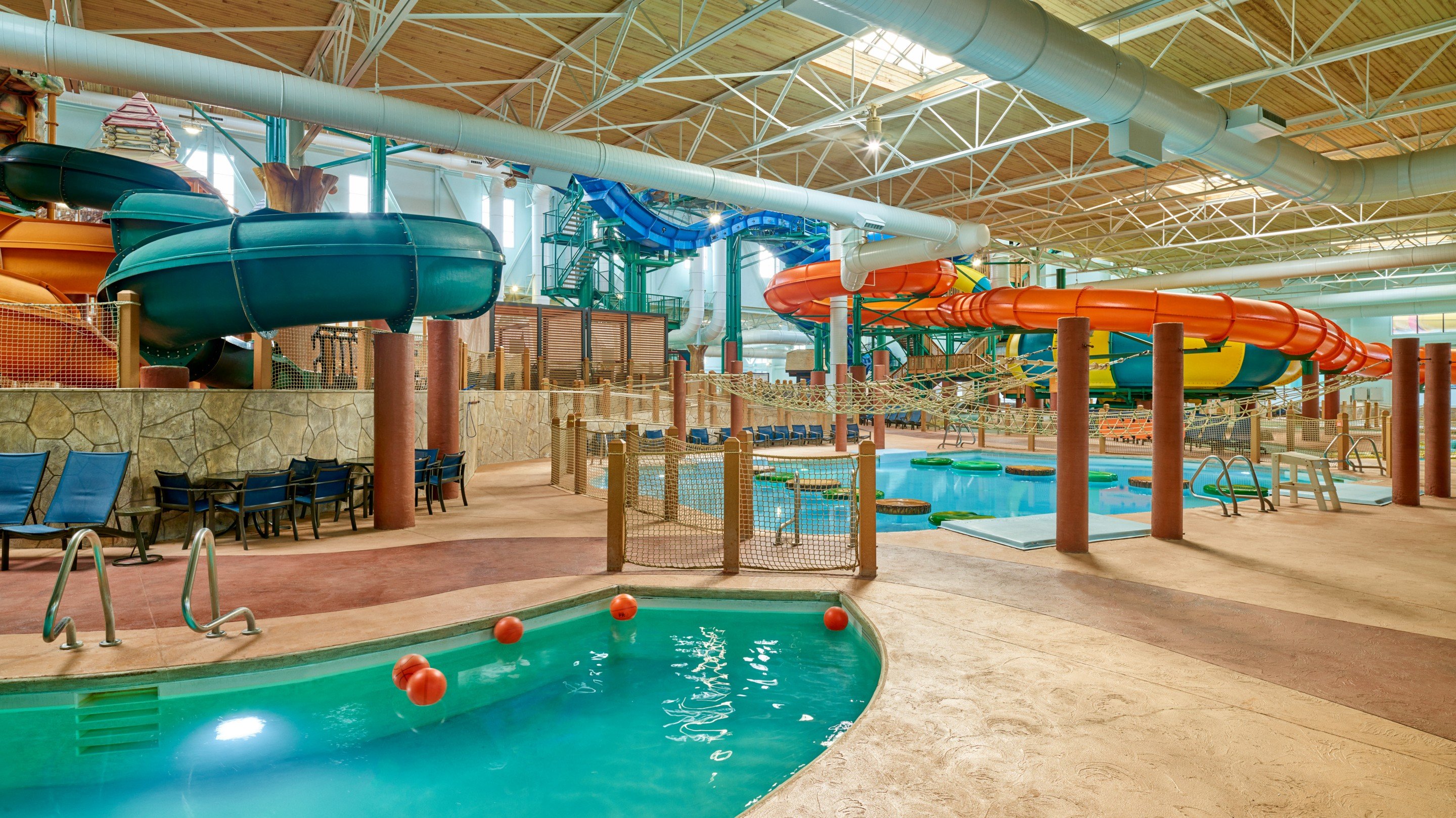 A large indoor water park featuring multiple water slides and attractions for visitors of all ages.