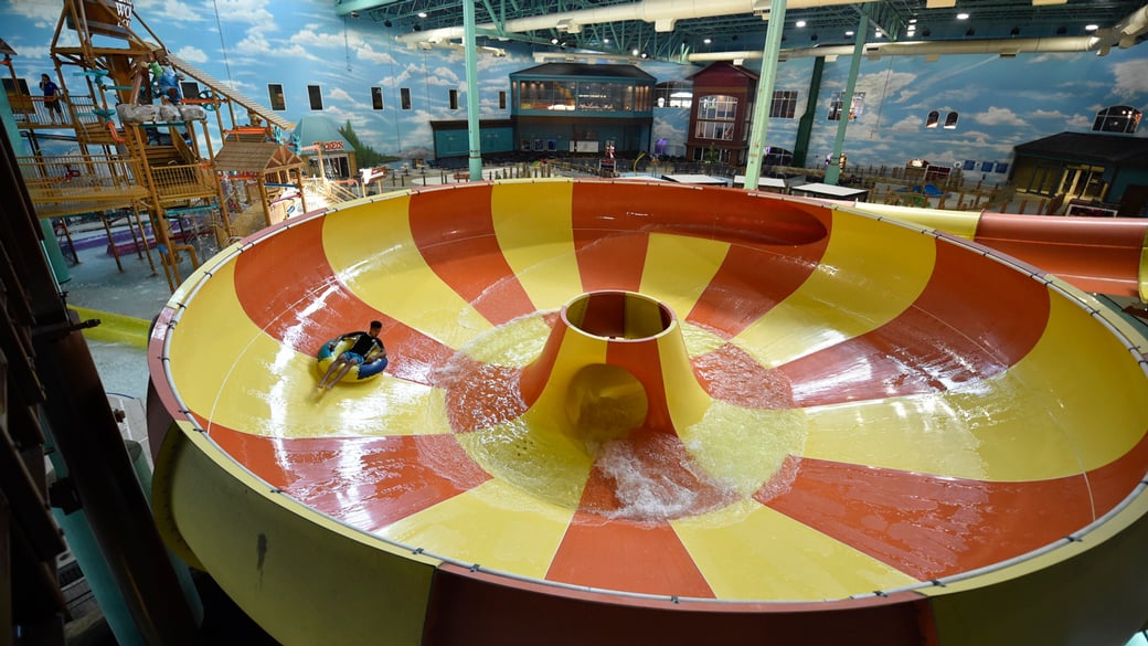 young boy at the Coyote Cannon ride at Great Wolf Lodge indoor water park and resort.